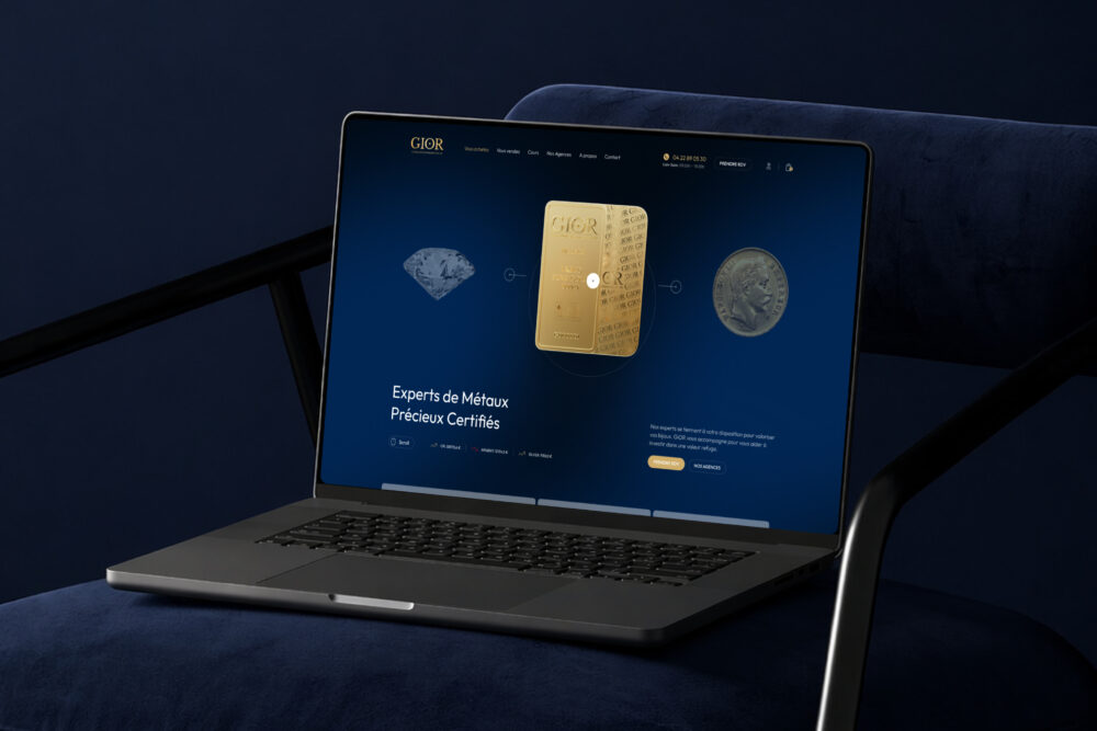 Laptop screen displaying a luxury metals webpage featuring a gold ingot a diamond and a coin against a blue gradient background | webstart
